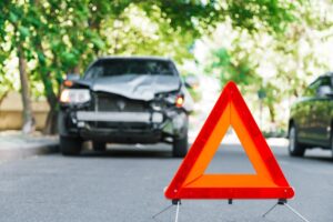 crashed car with an emergency triangle