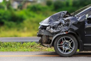 crushed black car