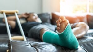 man with broken leg
