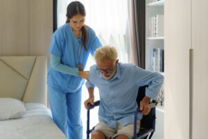 older burn victim getting help walking