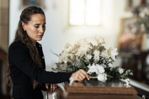 sad woman at coffin